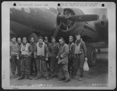 Thumbnail for General > Crew Of The 401St Bomb Group Which Has Just Returned From A Bombing Mission Over Frankfurt, Germany, Stand Near The Nose Of Their Boeing B-17 Flying Fortress, 29 January 1944.