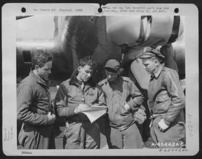 Thumbnail for General > Crew Members Of A Boeing B-17 "Flying Fortress" Discuss Their Flight Plans Before Taking Off From An 8Th Air Force Base In England, 16 June 1944, 401St Bomb Group.  They Are: Flight Officer Drake, Lt. Fox, S/Sgt. Hichaler And Lt. Horton.