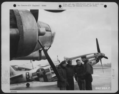 General > Lt. A.G. Cundy, Pilot Of The North American P-51 "Alabama Rammer Jammer" Of The 352Nd Fighter Squadron, 353Rd Fighter Group Talks With Crew Members Of The Bomber He Escorted To Their Home Base In England.  April 1945.