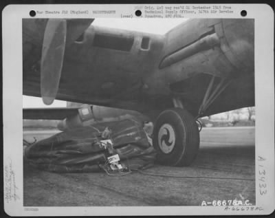 Thumbnail for General > Large Rubber Lift Bags Are Used To Aid In Jacking Up A Boeing B-17 "Flying Fortress" Whose Landing Gear Has Collapsed.  The Lift Bags Are Rolled Beneath The Wing And Inflated Until The Necessary Pressure Is Exerted To Raise The Wing.  Rubber Was Chose As