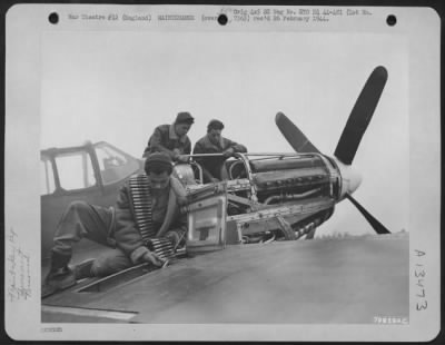 Thumbnail for General > Ground Crew Members Of The 9Th Fighter Command, Based At Boxted, England, Overhaul And Re-Arm A Fighter Plane For Its Next Mission Over Enemy Territory.  They Are: Sgt. Marvin Lippoff Of Bronx, New York (Foreground); Sgt. Robert L. Seager Of Flint, Michig