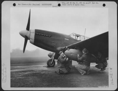 Thumbnail for General > Ground Crew Members Of The 9Th Fighter Command, Based At Boxted, England, Fit An Auxiliary Fuel Tank To The Wing Of A North American P-51 Before Take Off On A Mission Over Enemy Territory.