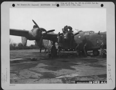 General > With Almost The Care Of A Mother For Its Child, The Crew Of The "Shoot Luke" Looks Her Over After Returning From A Mission Over Enemy Territory.  This Consolidated B-24 Has Been On 27 Missions.  Hardwick, England.  93Rd Bomb Group, April 1943.