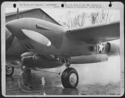 Painting & Washing > P-38's get a live steam bath to cleanse protective grease from exposed parts.