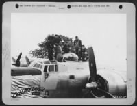 A flak wound Consolidated B-24 Liberator top turret gunner is removed from the plane by fellow crewmen and medical corpsmen after the plane had crash landed uponn returning from a mission to Magdeburg. - Page 1