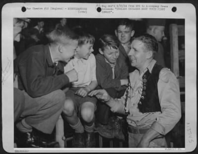 Thumbnail for General > Sgt. Vaughn Davis, Payson, Utah, a ground crew member at an 8th Air force base, tells these English youngsters about the wild west. Sgt. Davis is the first cowboy, except for the movies, that they've seen.