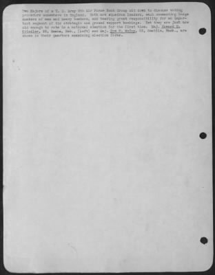 General > Two Majors of a U.S. Army 8th Air force Bomb Group sit down to discuss voting procedures somewhere in England. Both are squadron leaders, each commanding large numbers of men and heavy bombers, and bearing great responsibility for an important