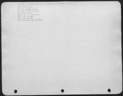 General > Planning a bombing mission in operations room: left to right: Maj. George Jones, Col. Harris Hull, Lt. Col. Stuart Porter, Lt. Col. W.H. Cleveland, Co. C.B.B. Bubb, Brig. Gen. N. Longfellow, Capt. C.F. Bourne, Maj. R.H. Stuart, Wing Commander Duke