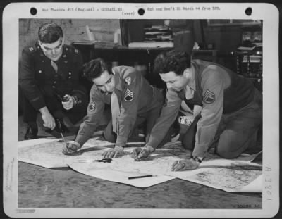 General > After receiving orders from Hdqs. the S-2 (Group Intelligence) officers and men fill in a multitude of details-weather, bomb loading, gasoline mileage, aiming point, pore over aerial photos of target, check enemy defenses in vicinity and then they