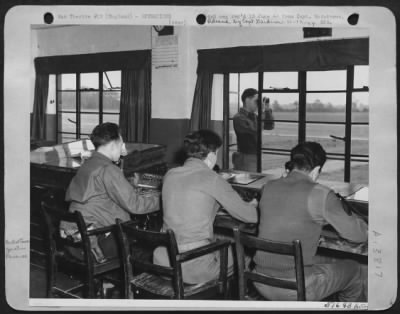 Thumbnail for General > Here are the men at the end of the England--France shuttle service which has been giving 24-hour service since the start of the invasion. They are control tower operators at an Eighth AAF Fighter Station where North American P-51 Mustangs led by Col.