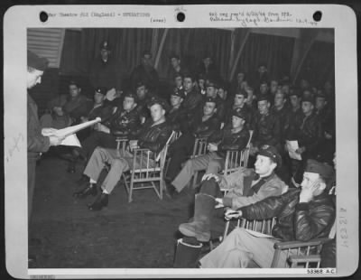 Thumbnail for General > These crewmen are being briefed for their shuttle mission that saw them take off from their bases in Britain fly over enemy held territory to bomb targets in the heart of Germany and then fly on to land in Russia. This attack, on 21 June 44, was the