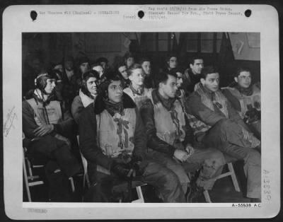 Thumbnail for General > ENGLAND-8TH Air force fighter pilots sit listening intently to the intelligence officer as he briefs them on the day's mission, outlining their targets and escort duties.