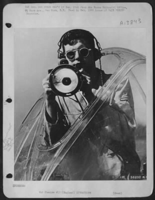 Thumbnail for General > Cpl. William H. Barnes, Jr., AAF Airdrome Traffic Controller in England. From the plexiglass dome, which was salvaged from a ofrtress, Cpl. Barnes has an unobstructed view of 360 degress of horizon, and, of course radio communication with planes