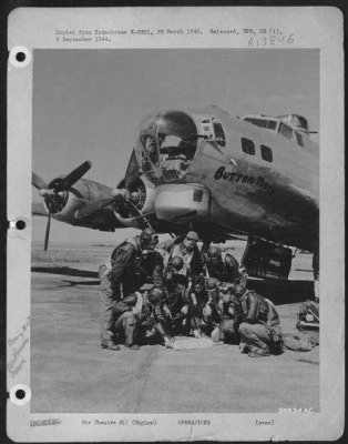 Thumbnail for General > ENGLAND--Gathered around their map of the target in fron of their ofrt, "Button Nose," are, left to right: T/Sgt. Alfred I. Haugen, top turret gunner, New Ulm, Minn.; Lt. C.J. Robertson, navigator, Chicago, Ill.; S/Sgt. T.G. Bowser, tail end Charlie