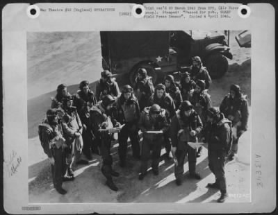 Thumbnail for General > As the early morning sun casts long shadows, 8th AF pilots prepare for the second relay on the shuttle-runs that blitzed Nazi transportation in the area ahead of the Rhine crossing Saturday, 24 March 1945. The first 78th Fighter Group pilots took off