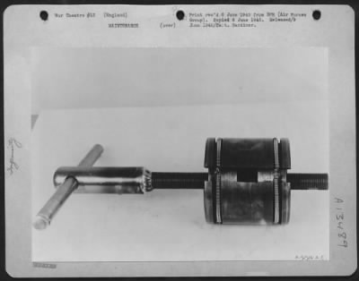 Thumbnail for Miscellaneous > A Field Coil Pole-Shoe Expander Devised And Constructed By T/Sgt. James W. Turner Of East Point, Ga., And S/Sgt. Levere M. Holmes Of Ogden, Utah, Enables Soldier-Technicians At An Air Service Command Depot In England, To Install New Field Coils In Repaire