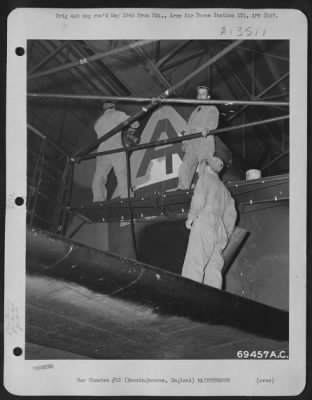 Thumbnail for Painting & Washing > Men Of The 364Th Service Group Spray Paint On The Tail Of A Boeing B-17 "Flying Fortress" At The 91St Bomb Group Base In Bassingbourne, England, On 25 September 1943.