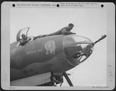 Thumbnail for Painting & Washing > Cpl. William E. Haley Of Chicago, Illinois And Cpl. Foy L. Jackson Of Flat Rock, North Carolina, Clean The Windows And Plexi-Glass Nose Of A Martin B-26 At Their Base At Colne, England.  Both Are Members Of The 323Rd Bomb Group.  21 July 1943.