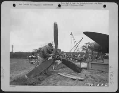 Thumbnail for Propellers > Cpl. James A. Taylor, Cleveland, Ohio, Repairs The Propeller Of The Boeing B-17 "Flying Fortress" "Stella", Which Crash Landed In A Field At Nr. Bournemouth, Hants, England.  Cpl. Taylor Is A Member Of The Mobile Repair Unit Of The 8Th Air Force Service C