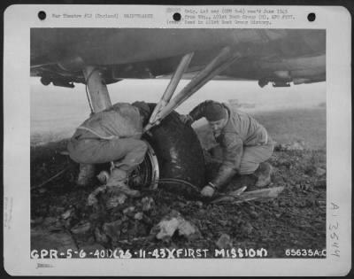 Thumbnail for Tires & Wheels > When A Boeing B-17 "Flying Fortress" Lands In The Mud, It Generally Makes A Pretty Good Impression.  Two Maintance Crew Members Of The 401St Bomb Group Are Busy Trying To Un-Mire The Wheels After One Of The Planes Landed Off The Runway Coming In From A Ra