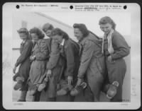 Thumbnail for Shoes Of Every Description Were Worn By These Nurses, Members Of An Air Evac Unit Missing For Two Months, Rescued From Albania After Their Plane Was Forced Down Enroute To Bari.  L To R: Lois Watson Of Oaklawn Ill., Lillian J. Tacina Of Detroit, Mich., Pa - Page 1