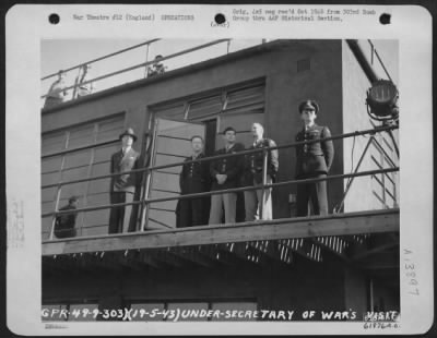 Thumbnail for General > Watching For Flying Fortresses.  Under Secretary Of War Robert M. Lovett And Party Peer Into Skies To Count Returning Planes After Bombing Mission Over Enemy Territory.  They Are Standing On The Cat Walk Of Control Tower.  303Rd Bomb Group, England.  19 M