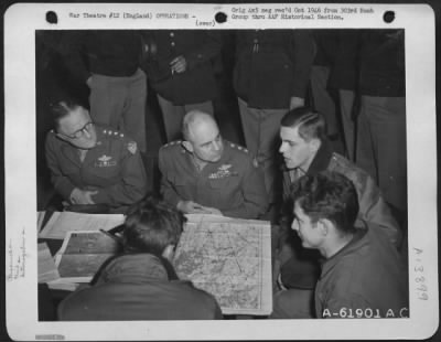 Thumbnail for General > General Carl Spaatz And Lt. General Jimmy Doolittle Discuss Results Of Bombing Raid On Oil Refinery At Halle, Germany, With Crews Who Participated In The Mission.  303Rd Bomb Group, England.  31 March 1945.