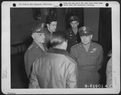 General > General Carl Spaatz And Lt. General Jimmy Doolittle Discuss Results Of Bombing Raid On Oil Refinery At Halle, Germany, With Crews Who Participated In The Mission.  303Rd Bomb Group, England.  31 March 1945.