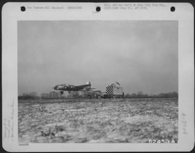 General > Boeing B-17 "Flying Fortress" Of The 493Rd Bomb Group, Being Guided To A Safe Landing By A Mobile Control Van At An Airbase In England, 22 January 1945.