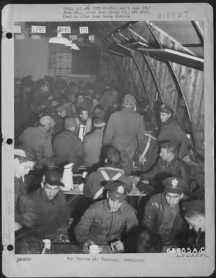 Thumbnail for General > Flyers Of The 401St Bomb Group Who Have Just Returned From A Successful Bombing Operation Over Germany Enjoy 'Java And Sinkers' While They Are Interrogated At An 8Th Air Force Base In England, 20 December 1943.