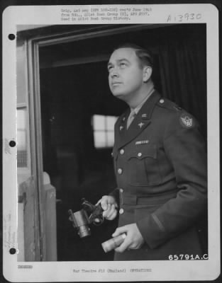 General > A Captain Of The 401St Bomb Group, Peers Into The Skies For Sight Of The Boeing B-17 Flying Fortresses Returning From A Mission Over Enemy Held Territory.  In His Hand He Holds A Very Pistol.  England, 28 December 1943.