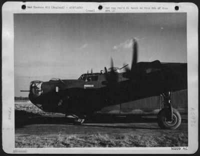 Consolidated > One of the returning Liberators just landing after a msision to Germany. Top turret gunner can be seen waving through upper hatch.