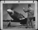 Thumbnail for A P-51 Mustang pilot, Lt. Bruce W. Rowlett, of Long Beach, Calif., gives the thumbs up sign to his assistant crew chief, Sgt. William R. Jensen of Provo, Utah, as he prepares to taxi his ship for take-off on a strafing mission in support of the - Page 1