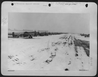 Thumbnail for North American > At a U.S. 8th AF fighter base in England, these North American P-51 Mustangs are photographed shortly before taking off on a mission over Germany. Lined up on the snow-covered perimeter, they present a different picture to the one shortly afterwards