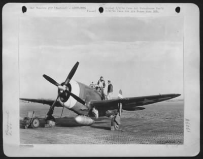 Republic > Crew Chief S/Sgt. Robert H. McCord of Nashville, Tenn. Assisting pilot 2nd Lt. Alvin Juchheim of Grenada, Miss. Preparatory to take-off in Republic P-47. 8th Air force, England.