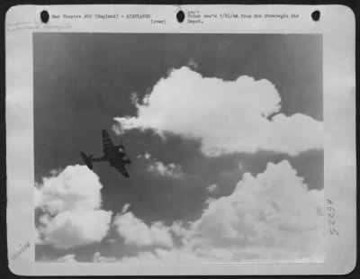 Thumbnail for British > It was not unusual to see British planes with American markings or American aircraft with British insignia. This De Havilland Mosquito, one of Britain's best fighting aircraft, sports the markings of the AAF as it wings over the English countryside.