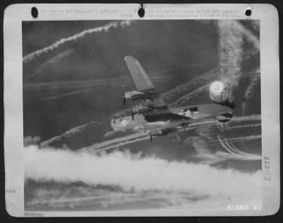Vapor Trails > MAJESTY AND STRENGTH: Like a battleship of the sky, an 8th AAF Liberator is on its way home after attacking a Nazi airbase on 21 February 44. Fighter contrails can be seen as the "Pea shooters" dart in and out seeking enemy aircraft that may be