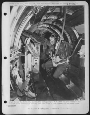 General > S/Sgt George W. James, Rt. 1, Box 268, Alburquerque, N.M. with his gun turned to two o'clock after receiving a warning from the pilot of the approach of an enemy plane.