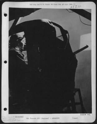 General > T/Sgt. Patrick M. McAttee of Smith Mills, Ky., veteran of 27 missions, holder of DFC and Air Medal with three clusters, gets in a practice session in a rear turret trainer. Sgt. McAttee has three German planes to his creidt, and flew the tough