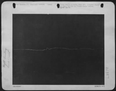 V-1 Over England > Setting up a time-exposure and then observing the flight of the bomb from a near by shelter, a photographer registered the "wake" of a German flying bomb. Each dot represents an explosion of the weapon's jet-engine. The incident occurred over a Ninth