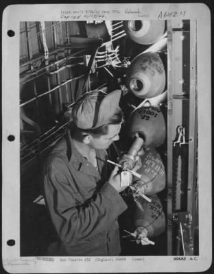 Thumbnail for General > One of the most hazardous of the many ordnanace jobs is the arming of bombs prior to an operational flight. Here Private First Class Linuel J. Putty, Morton Gap, Kentucky, member of the Liberator Group commanded by Colonel Luther J. Fairbanks