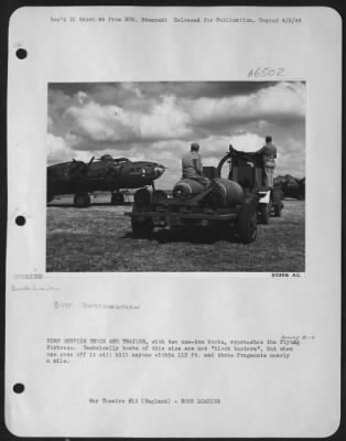 Thumbnail for General > BOMB SERVICE TRUCK AND TRAILER, with two one-ton bombs, approaches the Flying ofrtress. Technically bombs of this size are not "block busters", but when one goes off it will kill anyone within 110 ft. and throw fragments nearly a mile.