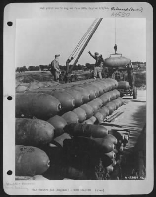 Thumbnail for General > ENGLAND-An Ordnance crew loading a trailer with two thousand pound bombs for a trip to Hitler-land in a B-24. (Kodachrome #2385-A)