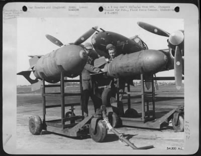 Thumbnail for General > ENGLAND-Besides being used for strafing German installations and to escort 8th AF heavy bombers to strategic enemy targets and Lockheed P-38 Lightning fighter is also used for high altitude and dive bombing. Here two 1,000 pound demolition bombs