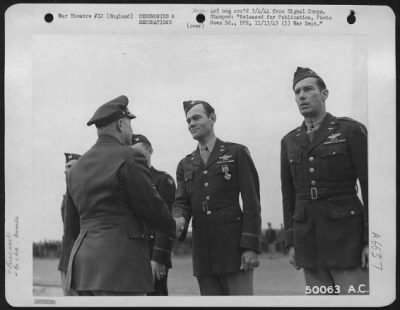 Awards > ESSEX, ENGLAND-After receiving the Distinguished Flying Cross, Colonel Carl R. Storrie was congratulated by Brig. General Robert C. Candee.