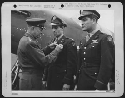 Thumbnail for Awards > ENGLAND-General Dwight D. Eisenhower, Supreme Allied Commander of the Invasion forces, presents the Distinguished Service Cross, second highest U.S. Award, to Capt. Don S. Gentile, 23, of Piqua, Ohio, leading fighter pilot in the European Theatre