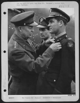 Thumbnail for Awards > England-General Dwight D. Eisenhower, Supreme Allied Commander of the Invasion forces, presents the Distinguished Service Cross, second highest U.S. Award, to Colonel Donald J.M. Blakeslee, Commanding Officer of ETO's highest scoring fighter