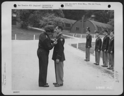 Thumbnail for Awards > ENGLAND-Lt. General Lewis H. Brereton, Commanding General of the Ninth Air force, awards the Silver Star to Capt. Warren S. Emerson in ceremonies at the Ninth Air force Headquarters in Britain. Capt. Emerson was a first Lt. when he perofrmed