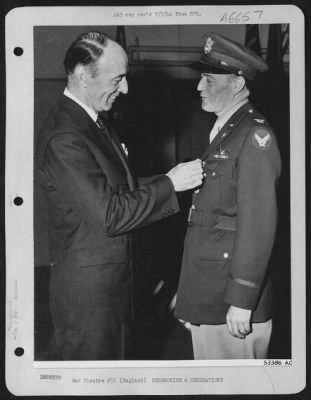 Awards > Colonel Kenneth R. Collins of 180 W. 58th St., New York, N.Y., is awarded the Legion of Merit, Degree of  Legionnaire by Mr. R.M. Lovett, Asst. Sec. of War for Air. ENGLAND