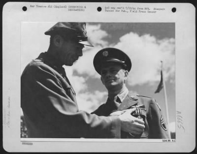 Thumbnail for Awards > ENGLAND-The Distinguished Flying Cross is presented to S/Sgt. Paul Saffron, 901 Highview St., Pittsburgh, Pennsylvania, by Colonel Reginald Vance, San Antonio, Texas, Commanding Officer of the Silver Streaks, 9th Air force Marauder group.